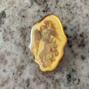 Vintage gold tone angel pin about 1 1/4 in long
